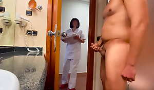 I surprise the hotel cleaning girl who comes to clean the toilet and helps me accomplish cumming