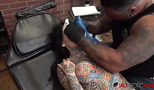 Tiger Lilly gets a forehead tattoo while nude
