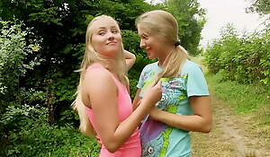 Teenage lesbian women having fun outdoors - youthful women