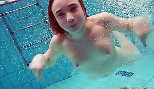 Adorable hairy pussy teenie Nina upon the swimming pool