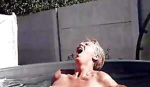 Bathing a joyful housewife Lukerya in a mini conjoin naked lower bright sunlight